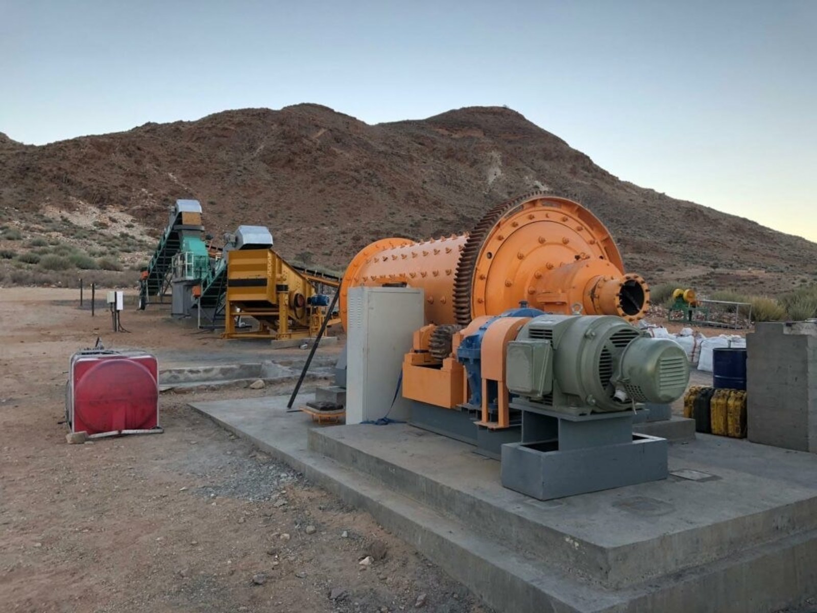 Photo 5 showing commercial scale rod mill, screeners and conveyance systems