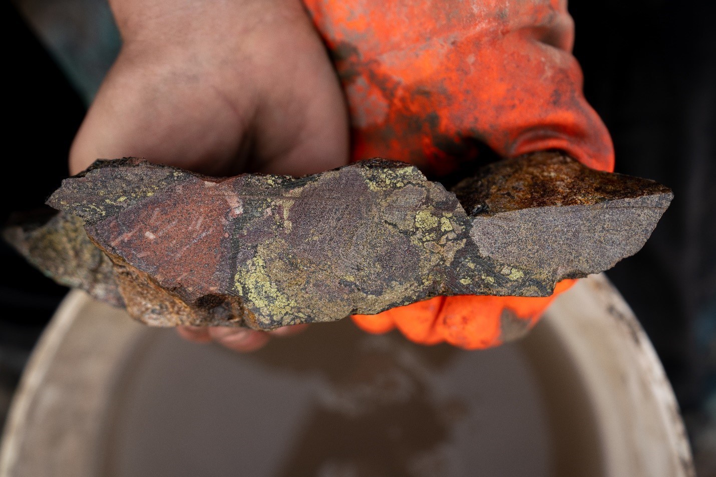 Representative sample from Ridge Zone Channel Sample #1 (“BRCH19-001”); a 37-metre continuous channel sample taken on surface at the “Green Rock” showing. Chalcopyrite, sphalerite, and pyrite cement of hydrothermal breccia is observed. This new showing is ~350m south of drill pad “A-1” along the Burgundy Ridge Trend. Assay results are pending. (CNW Group/Crystal Lake Mining Corporation)