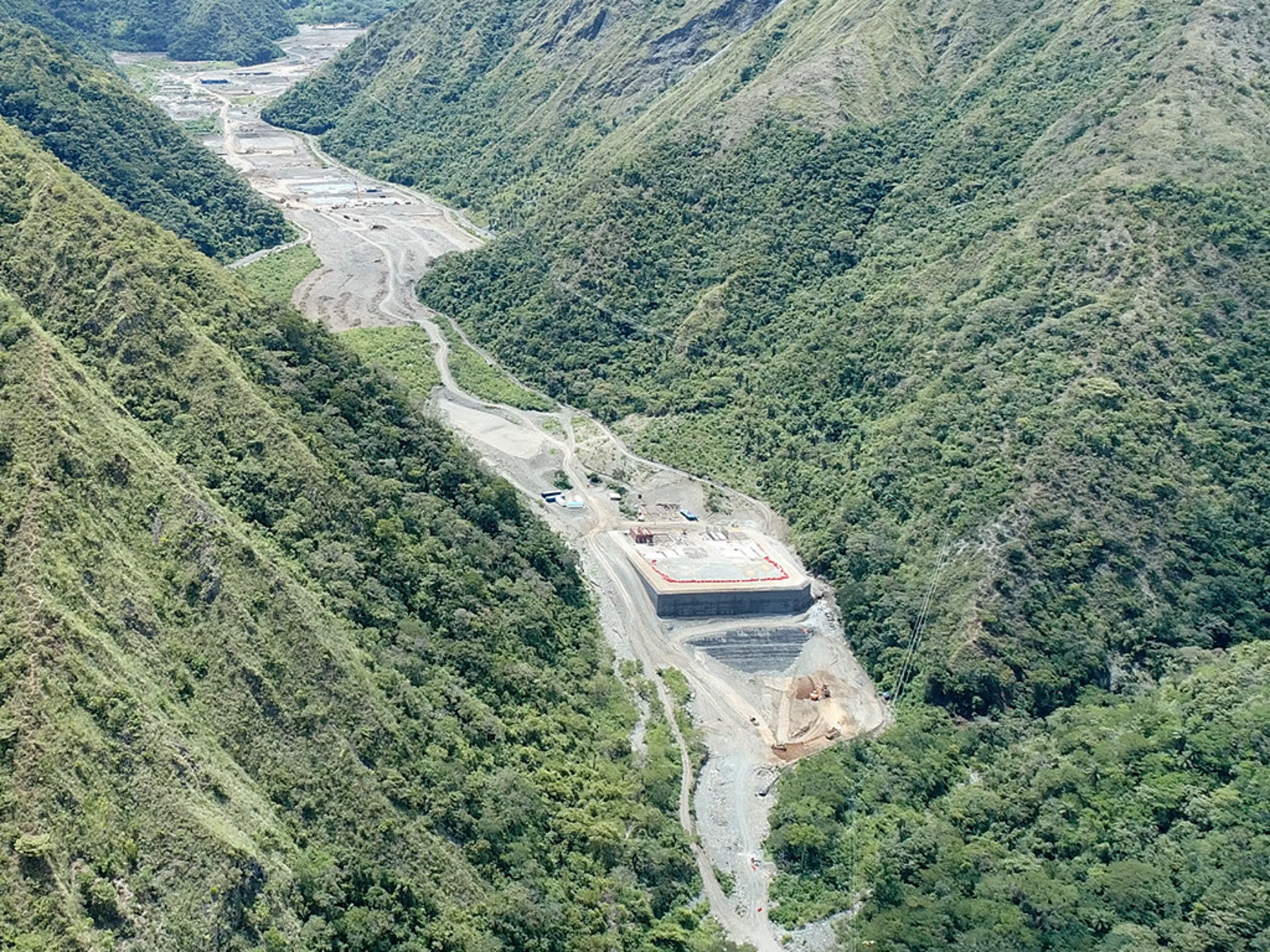 Photo 3: Site view of tailings storage with water treatment facility in foreground