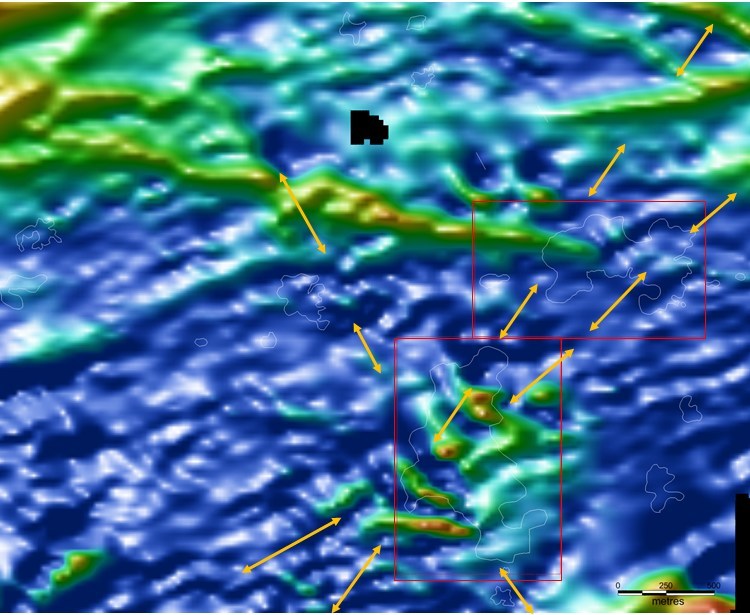 Figure 3: Same view window as Figure 2; showing reduced to pole; high frequency spectrum filtered ground magnetic data  with artisanal workings outlined in white. Note the yellow arrowed dashes which correspond to either the  alignment of artisanal  workings or sampled mineralisation correspond well with NNW, NE and NW striking structures/magnetic breaks. (CNW Group/Tajiri Resources Corp.)
