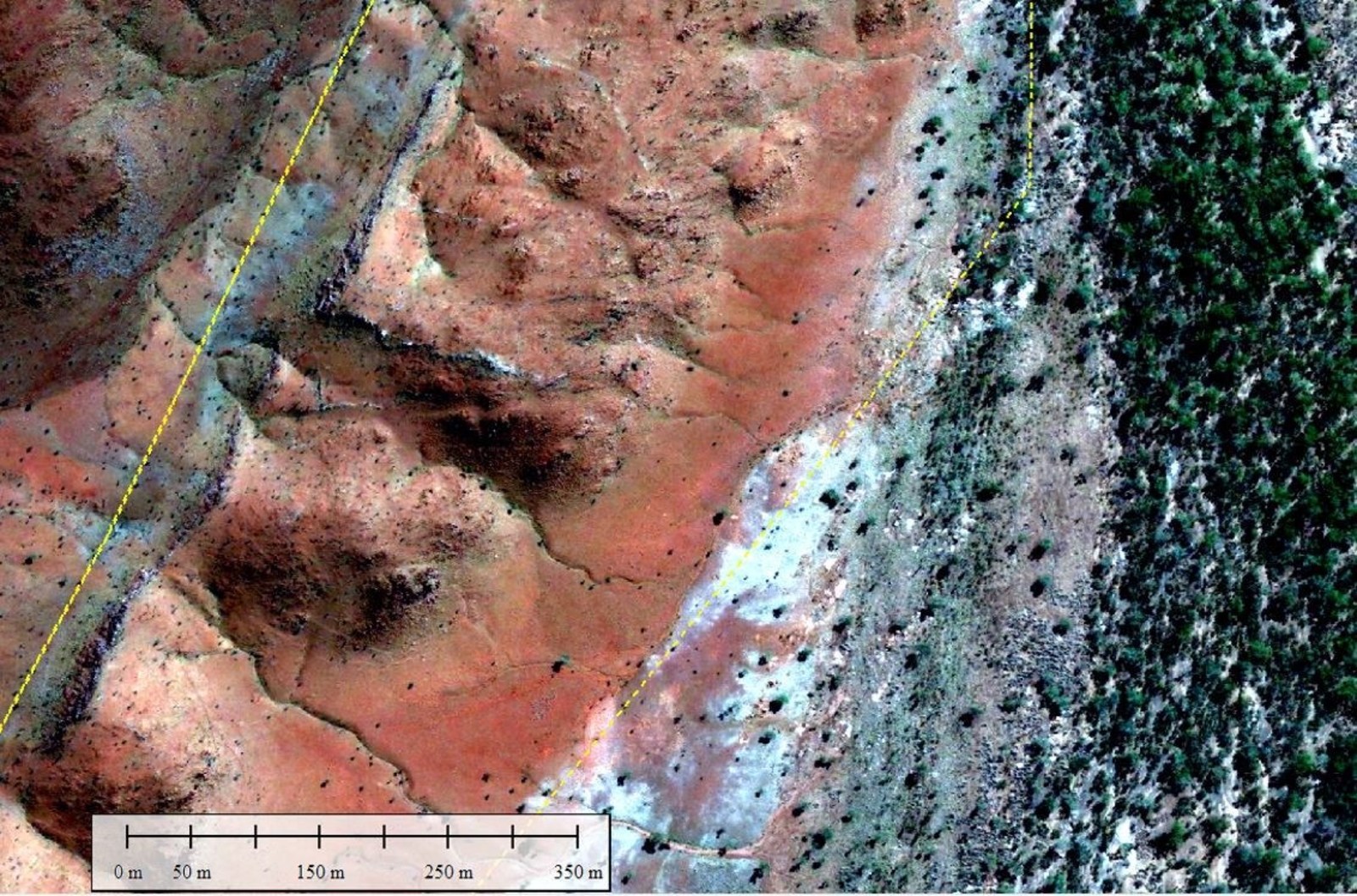 Figure 5. 300 m wide erosional edge and talus slope falling away from the Mount Roe high area in upper left of air photo.