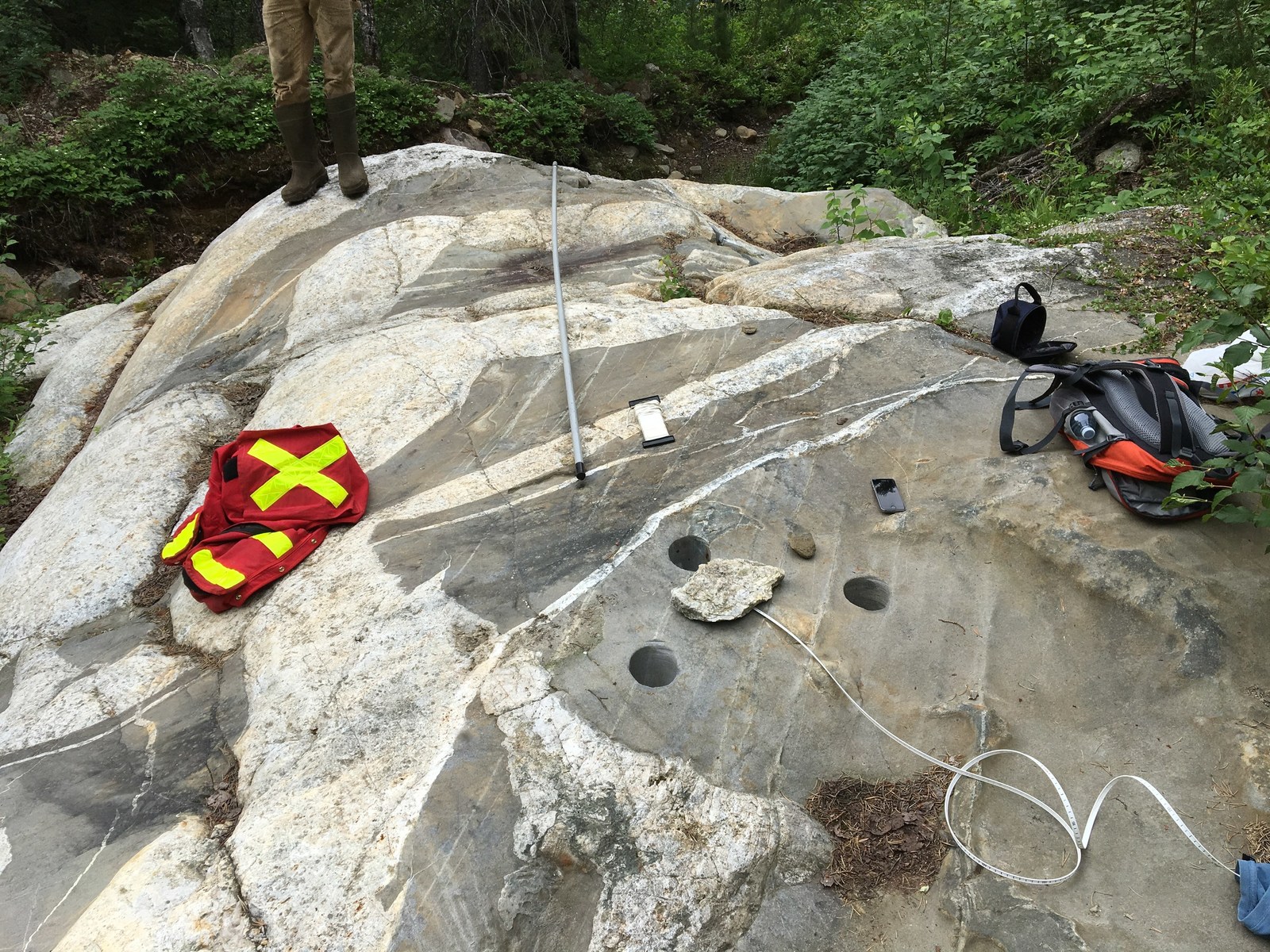 Taking groundwater level measurements and conducting permeability tests on boreholes at Georgia Lake.