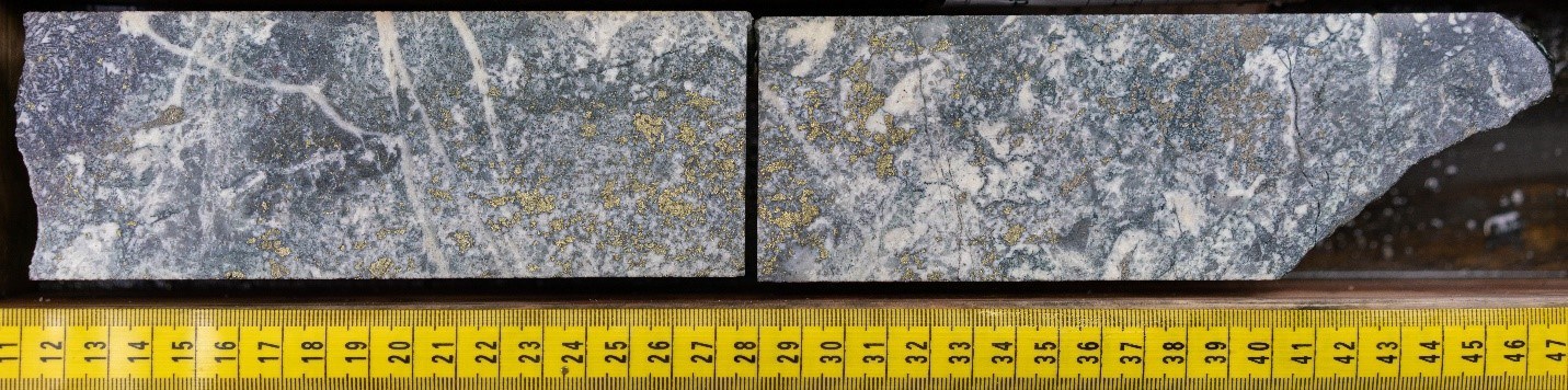 Sulphide mineralization dominated by chalcopyrite with lesser pyrite. Note acicular magnetite well-defined in top left corner. Image starting at 111.12m in NWDDH19-012; the second diamond drill hole at the NW Zone in 2019. Note mineralization is visually high-grade and not representative of the entire hole. (CNW Group/Crystal Lake Mining Corporation)