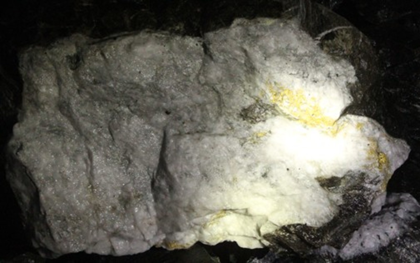 Figure 2: Visible gold in quartz extensional veining, from breakthough cut on 14 level exploration drive
